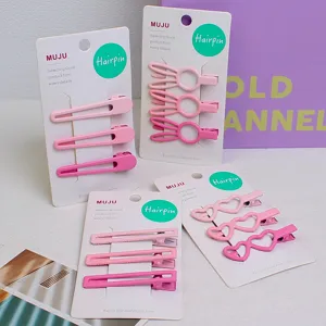 Set de pinces à cheveux en métal rose, design cœur et lapin creux, vue détaillée.