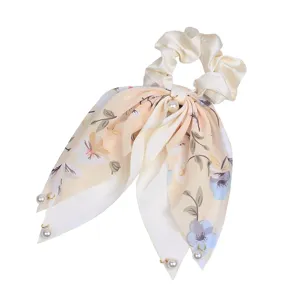 Elegant floral silk scrunchie with pearl pendant and long ribbon streamers for women.