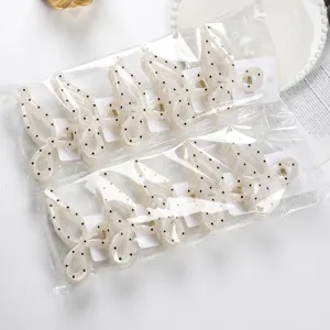 Fashion polka dot butterfly hair claw clips set, cute white hair accessories for women.