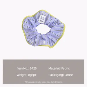 Sweet purple striped fabric scrunchie with cute bear tag, perfect hair accessory for daily wear.