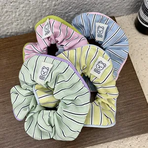 Sweet striped scrunchies with cute bear tags, soft fabric hair ties for daily pony-tail styles.