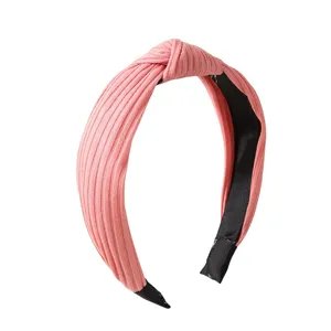 Pink ribbed knotted headband for women, wide hair hoop casual daily fashion accessory.