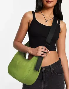 Detailed view of the stylish green hobo shoulder bag with wide black strap for women.