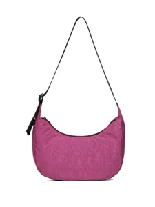 Magenta crescent shoulder bag detail view, showing the adjustable black strap and smooth zipper.