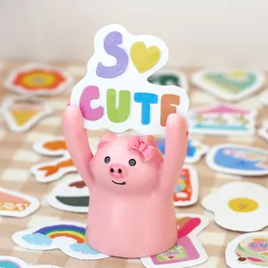 Cute pink pig desktop card holder memo stand featuring colorful cartoon stickers decor.