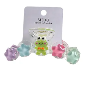Cute cartoon star hair claw clip with colorful transparent design and adorable green frog accent.