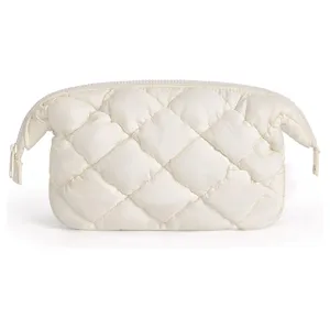 White quilted cosmetic bag travel toiletry pouch soft puffy makeup organizer for women daily use.