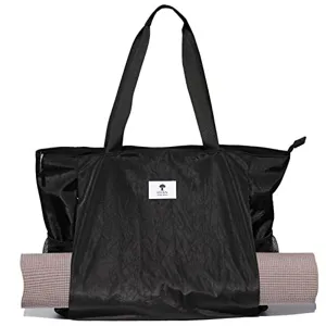 Sac de sport noir avec support pour tapis de yoga et double poignée de transport.