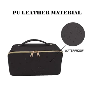 Detailed view of black PU leather cosmetic bag with waterproof woven texture and gold zipper.