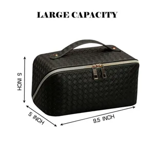 Large capacity black woven cosmetic bag, portable travel makeup organizer with secure zipper.