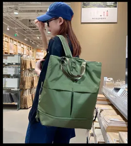 Grand sac à dos vert multifonctionnel et sac cabas pour les loisirs et l'école.