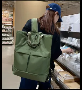 Grand sac à dos en toile vert olive, sac cabas décontracté avec bretelles pour un usage quotidien.