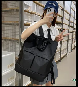 Grand sac à dos noir multifonctionnel grande capacité pour étudiants et voyage.
