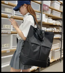 Grand sac à dos noir multifonctionnel de grande capacité pour les déplacements quotidiens et l'école.