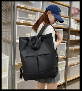 Vue détaillée du grand sac à dos noir multifonction avec compartiment inférieur pour usage quotidien.