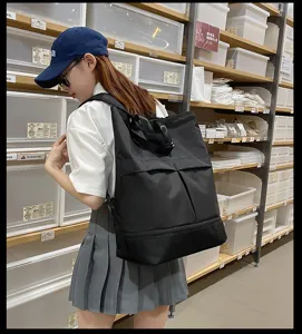 Sac à dos noir multifonctionnel de grande capacité, idéal pour l'école et les voyages.