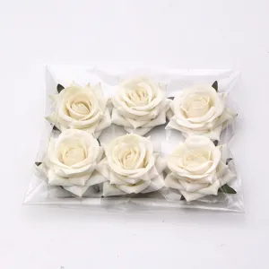 Artificial white rose flower heads for DIY crafts, wedding decoration and floral arrangements.