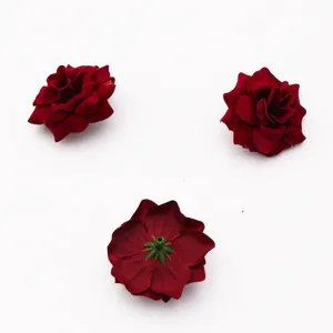 Velvet rose flower head detail shot showing front petals and green back receptacle base.