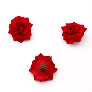 Detail view of 4.8cm artificial red velvet rose flower heads for DIY crafts and wedding decor.