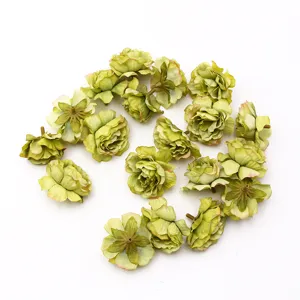 Artificial silk flower heads close-up, small tea bud design for DIY home decor and accessories.