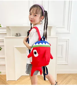 Detailed view of cute cartoon shark kids backpack, vibrant red school bag for toddlers.