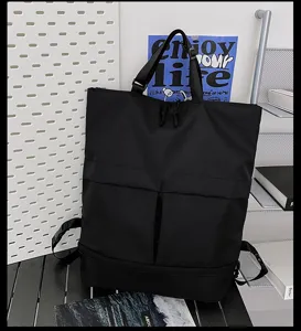 Sac à dos et fourre-tout noir multifonctionnel pour homme grande capacité en détail.