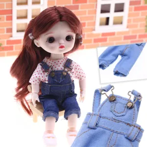 Detailed view of miniature denim overalls and polka dot shirt for BJD cotton dolls.