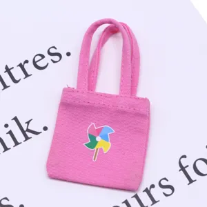 Miniature dollhouse pink canvas tote bag with colorful pinwheel print for BJD doll items.