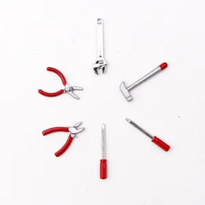 Miniature dollhouse alloy tool set, 1:12 scale detailed view showing tiny hammers and pliers.