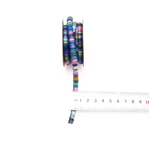Detailed view of colorful ethnic braided cord showing size scale for DIY crafts and accessories.