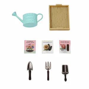 Dollhouse miniature gardening tool set with watering can, tray, seed bags, and tiny metal tools.