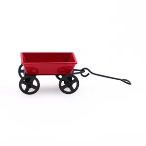 Dollhouse miniature red iron wagon detail, small metal cart prop for micro landscape decoration.