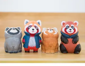 Hand-carved wooden animal figurines, detailed close-up of four cute colorful desktop ornaments.