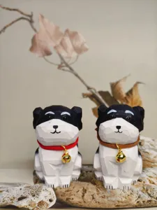 Hand-carved wooden dog figurine with bell, cute black and white desktop and car decor.