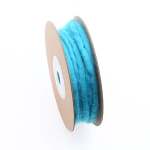 Wool felt cord close-up, bright blue color detail for DIY craft decorations and Christmas tree trim.