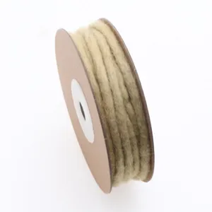 Handmade wool felt cord roll detail for DIY crafts, Christmas tree decorations and wreaths.