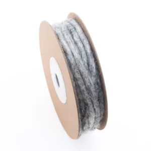Grey felted wool string detail shot, natural wool craft rope for DIY decoration projects.