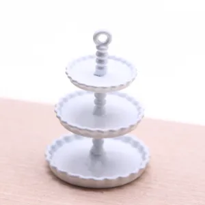 Miniature white 3-tier dessert cake stand model for dollhouse decoration and display.