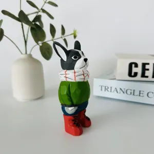Hand-carved wooden French bulldog figurine detail showing exquisite craftsmanship and cute winter outfit.