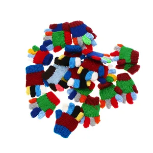 Close-up detail of miniature knitted gloves for dollhouse micro-scene decoration and hobby crafts