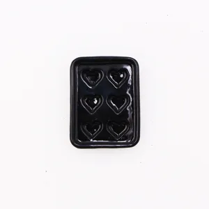 Miniature 1:12 dollhouse black baking tray with six heart molds, perfect for dollhouse decor.