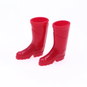 Miniature red rain boots for dollhouse BJD OB11 dolls, cute silicone garden doll shoes detail.