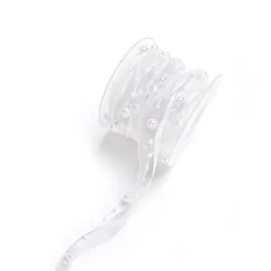 White pearl chiffon ribbon detail view, elegant sheer fabric trim for DIY crafts and gifts.