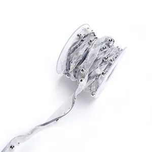 Silver sheer organza ribbon roll with pearl beads for gift wrapping and DIY crafts decor.