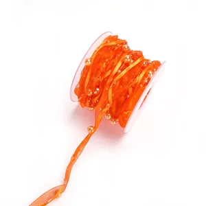 Orange ribbon with pearls, 10m roll, polyester sheer organza for gift wrapping and DIY crafts.
