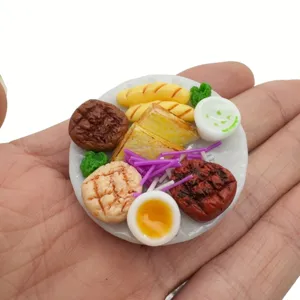 Miniature dollhouse food plate detail, realistic mini steak and bread resin model setup.