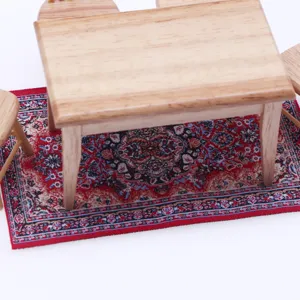 Detailed close-up of miniature dollhouse Turkish style rug and wooden furniture scene set.