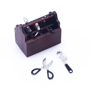 Miniature dollhouse wooden toolbox and alloy repair tools set detail shot for dollhouse scene.