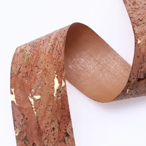 Natural eco-friendly cork ribbon detail showing gold foil PU leather texture and flexible roll material.