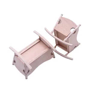 Miniature wooden dollhouse crib rocking chair set furniture micro model toy white background.